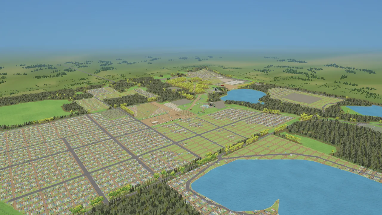 Aerial view of a whole festival site on a sunny afternoon: campgrounds, woods, lakes and stages